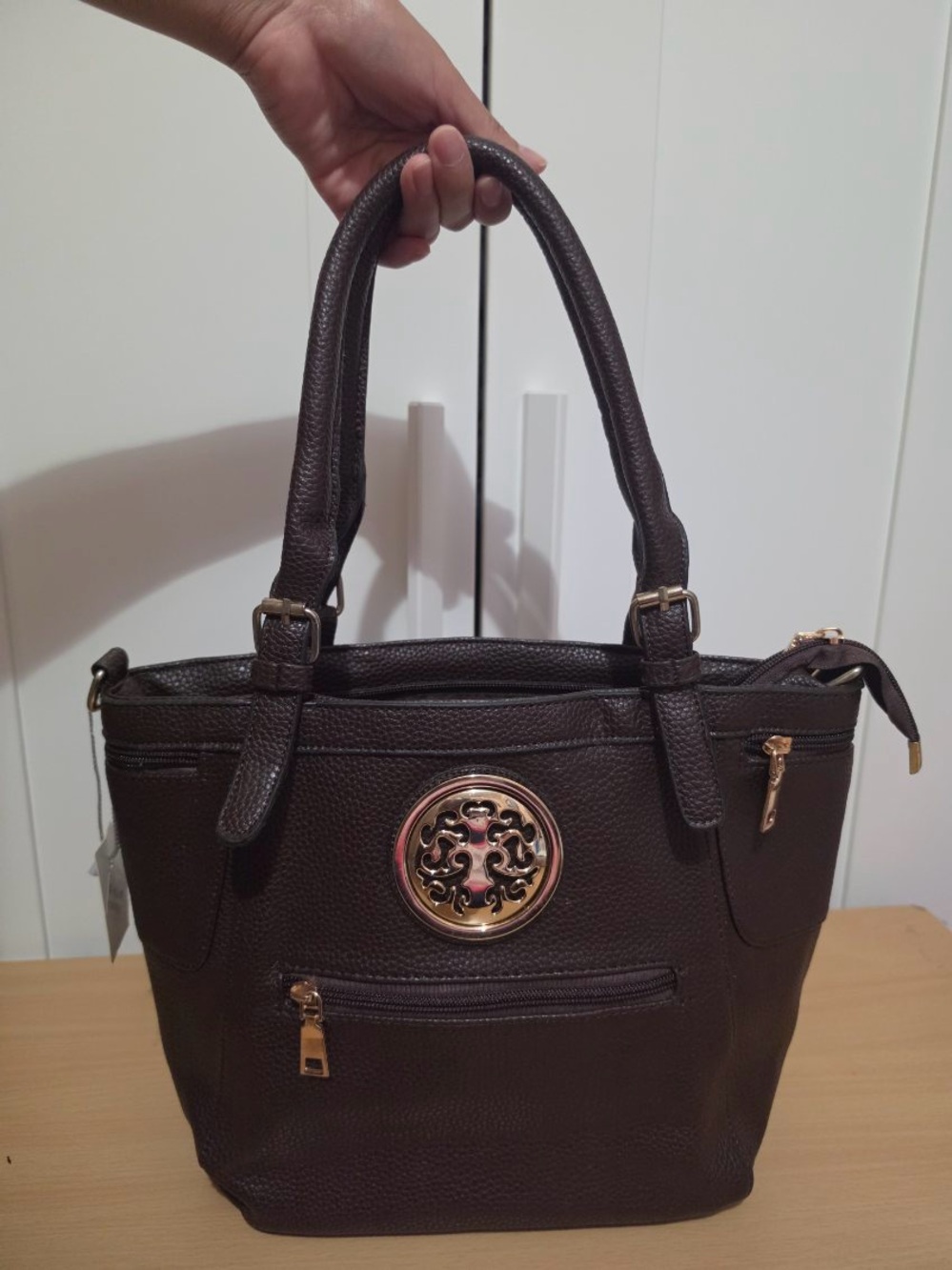 Dark Brown Tote Handbag with Gold Medallion Accent